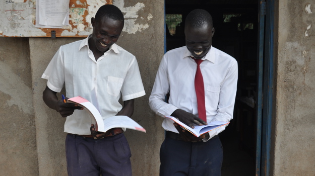 Mayol On The Right Reading Outside His School Library With His Friend Salid Book Aid